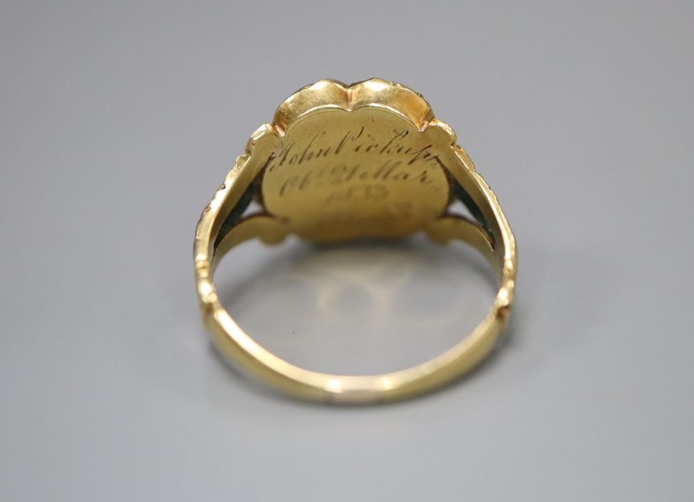 A William IV gold (tests as 14ct) and black enamel memorial ring set with a single diamond, size K/L, gross 3.6 grams,